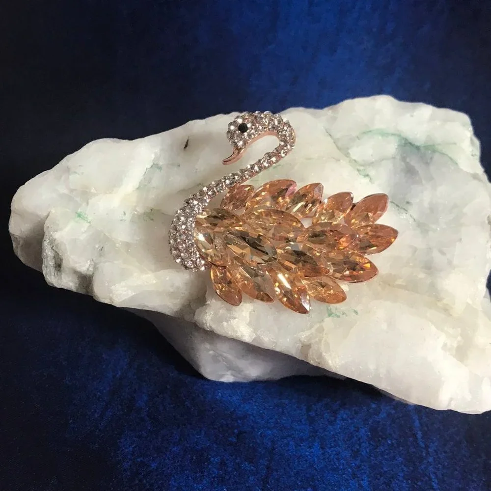 Rose gold swan brooch with gems and rhinestones
